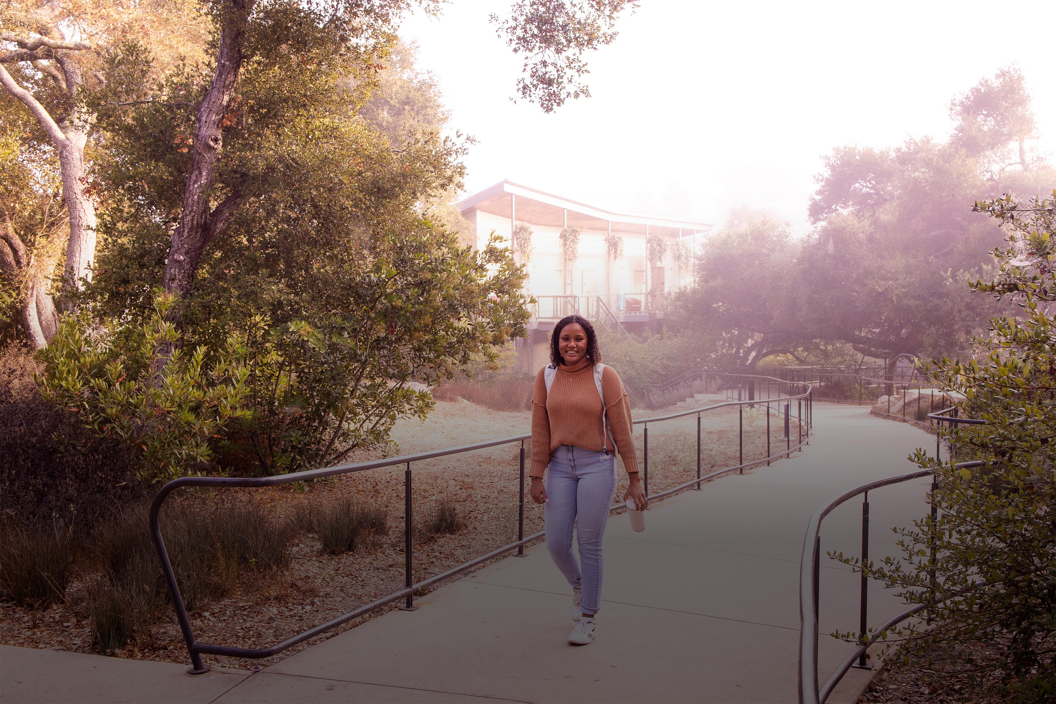 woman walking on westmont campus in the morning fog